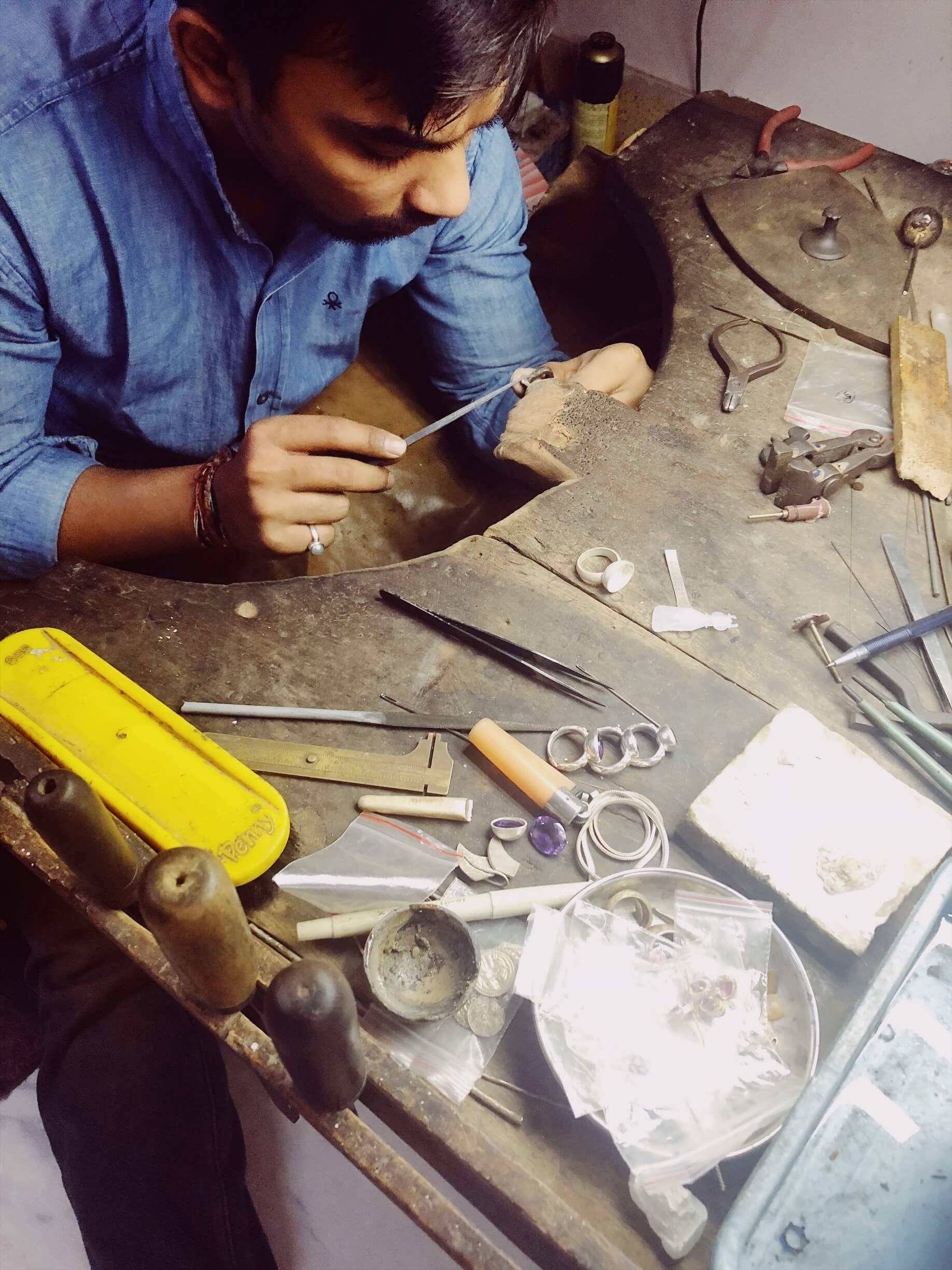 https://cdn.shopify.com/s/files/1/0039/6643/5377/files/Filing_the_jewellery_on_the_bench.jpg?v=1562657287